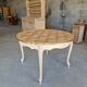Round table made of cherry wood, sanded and varnished.