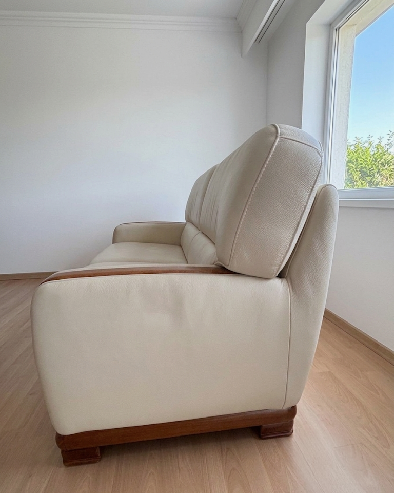 Beige leather sofa with solid wood frame