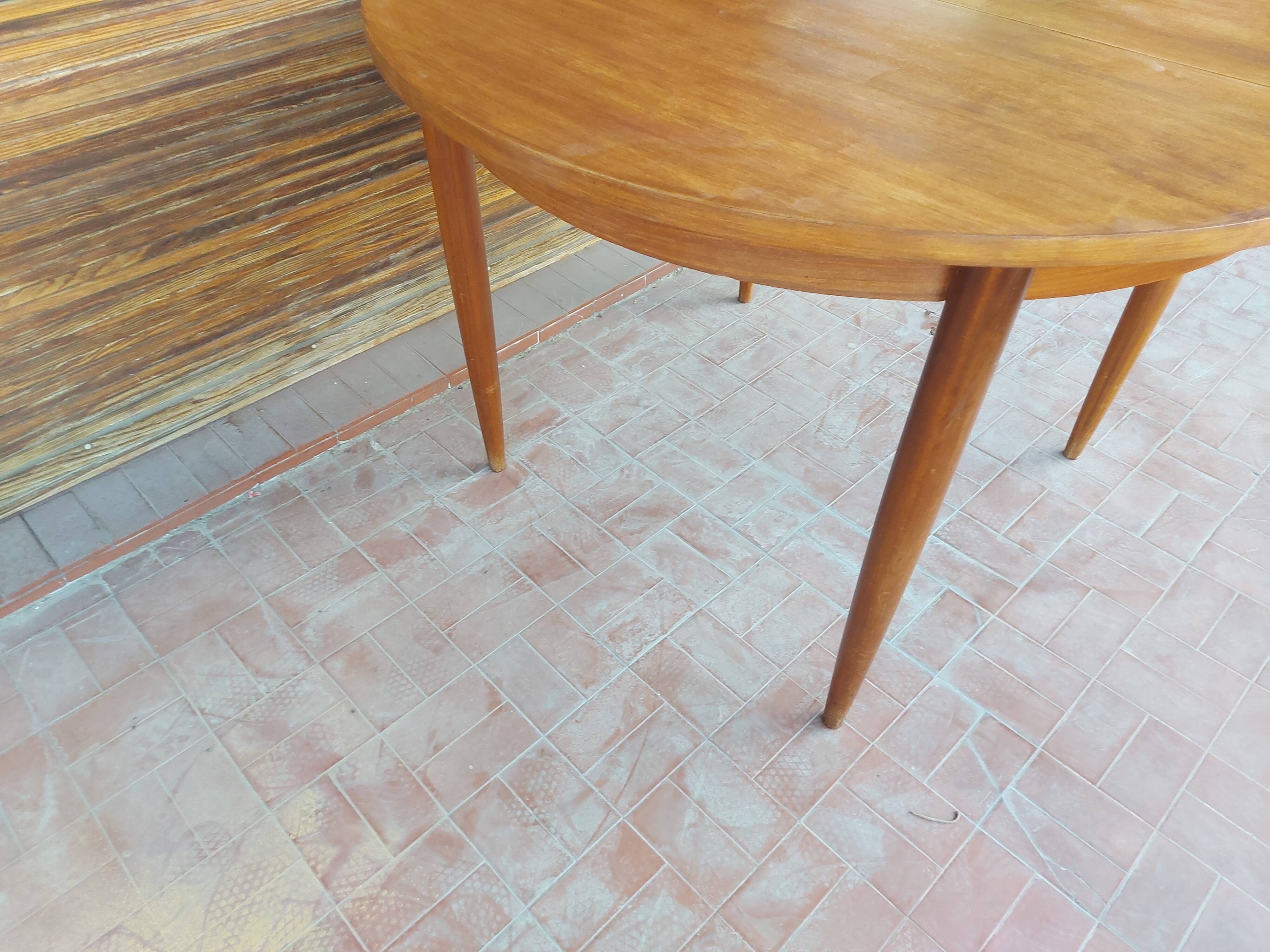 Scandinavian design teak table with extension cord