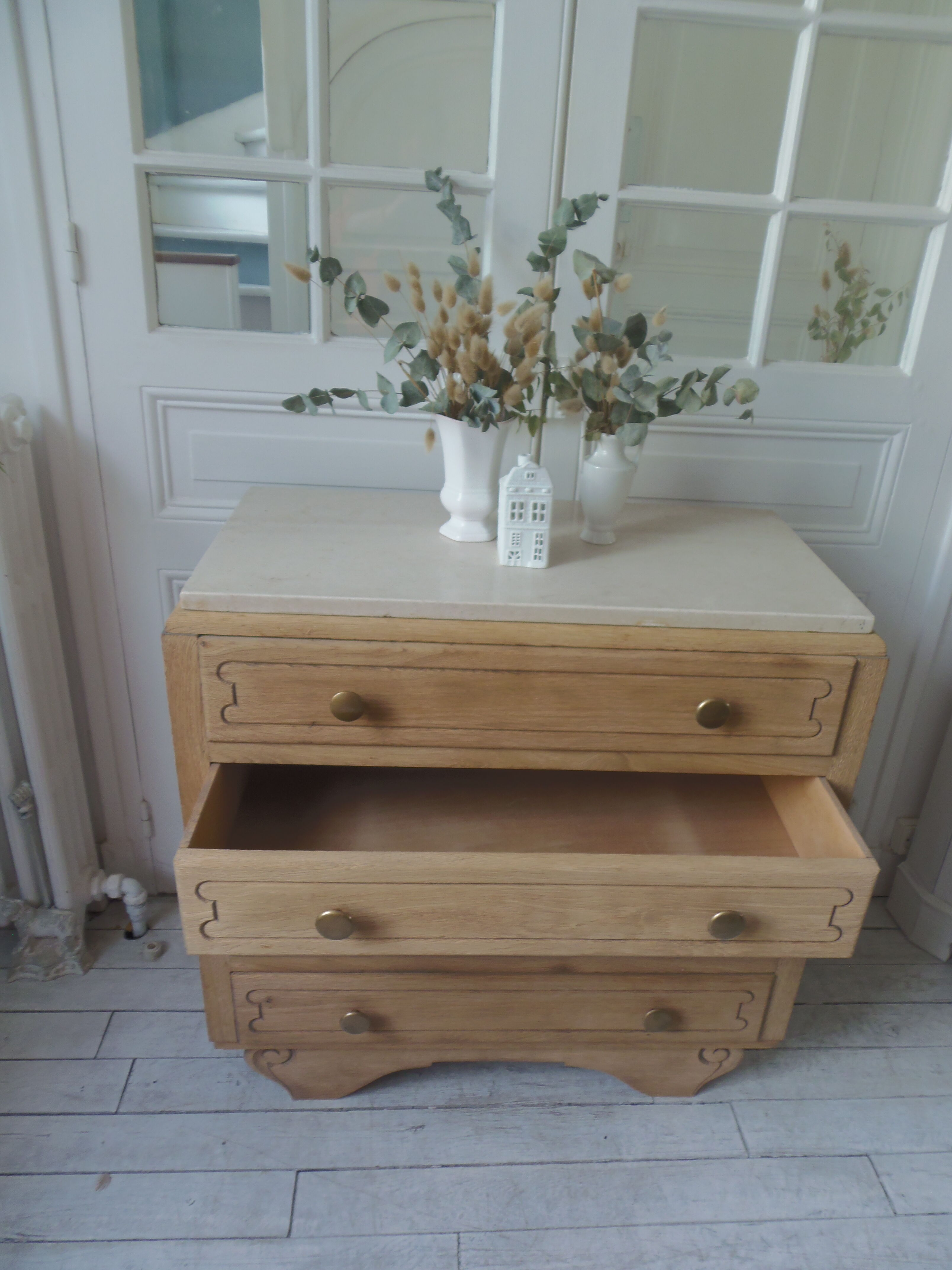 Vintage oak chest of drawers, a travertine plate laid for tray.