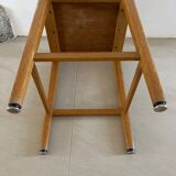 Vintage stool from the 60s with aged leather seat