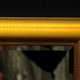 Large mirror in a golden decorative frame