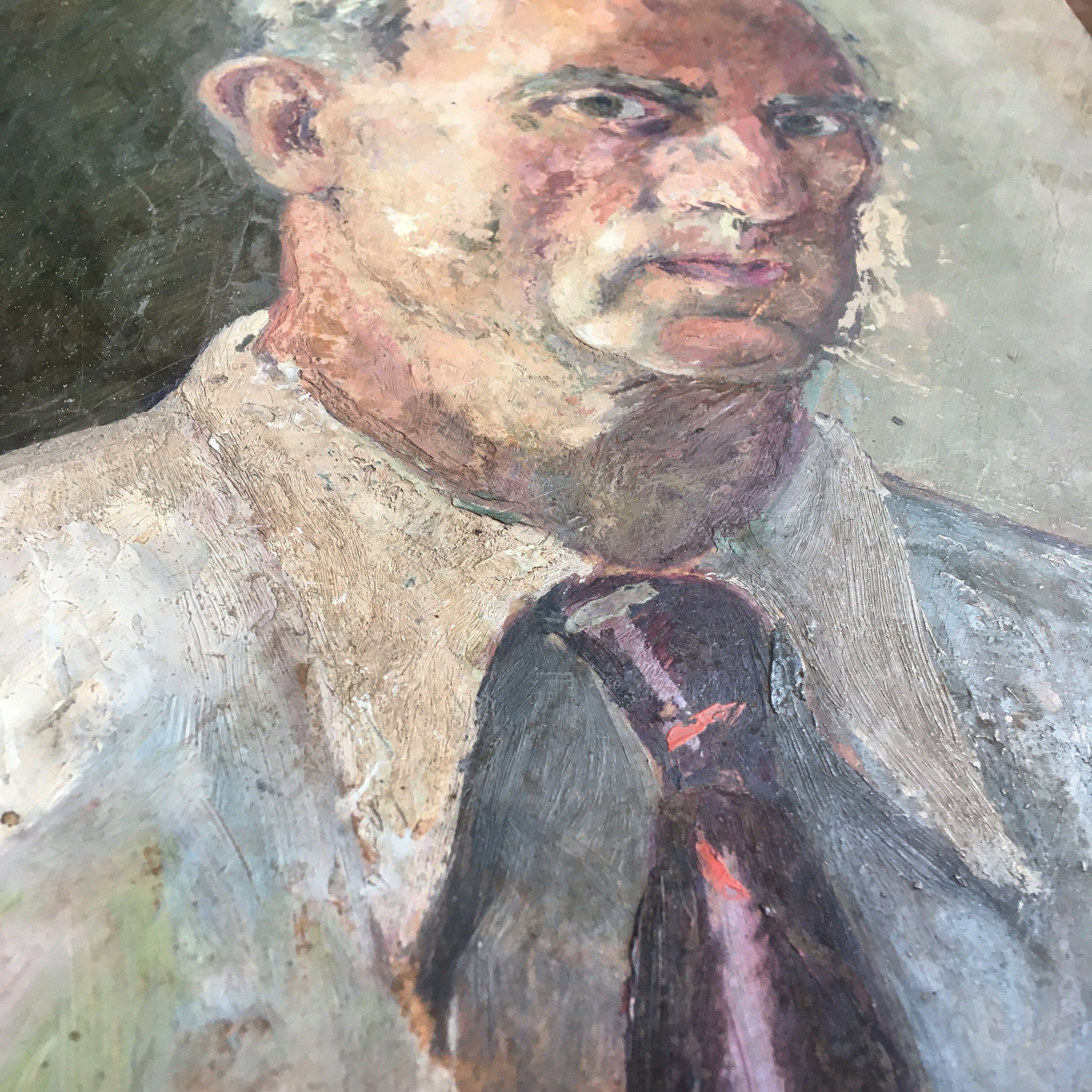 Portrait of a man with oil painting. Oil on Isorel. Oil painting. 1930s. Vintage portrait.