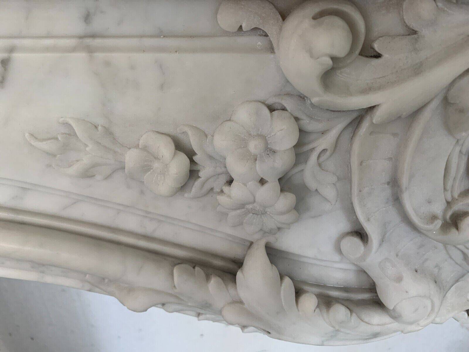 Louis XV style fireplace in white Carrara marble 19th century