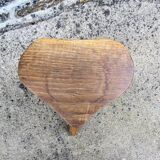 Farm stool in raw wooden sitting in the shape of a popular art