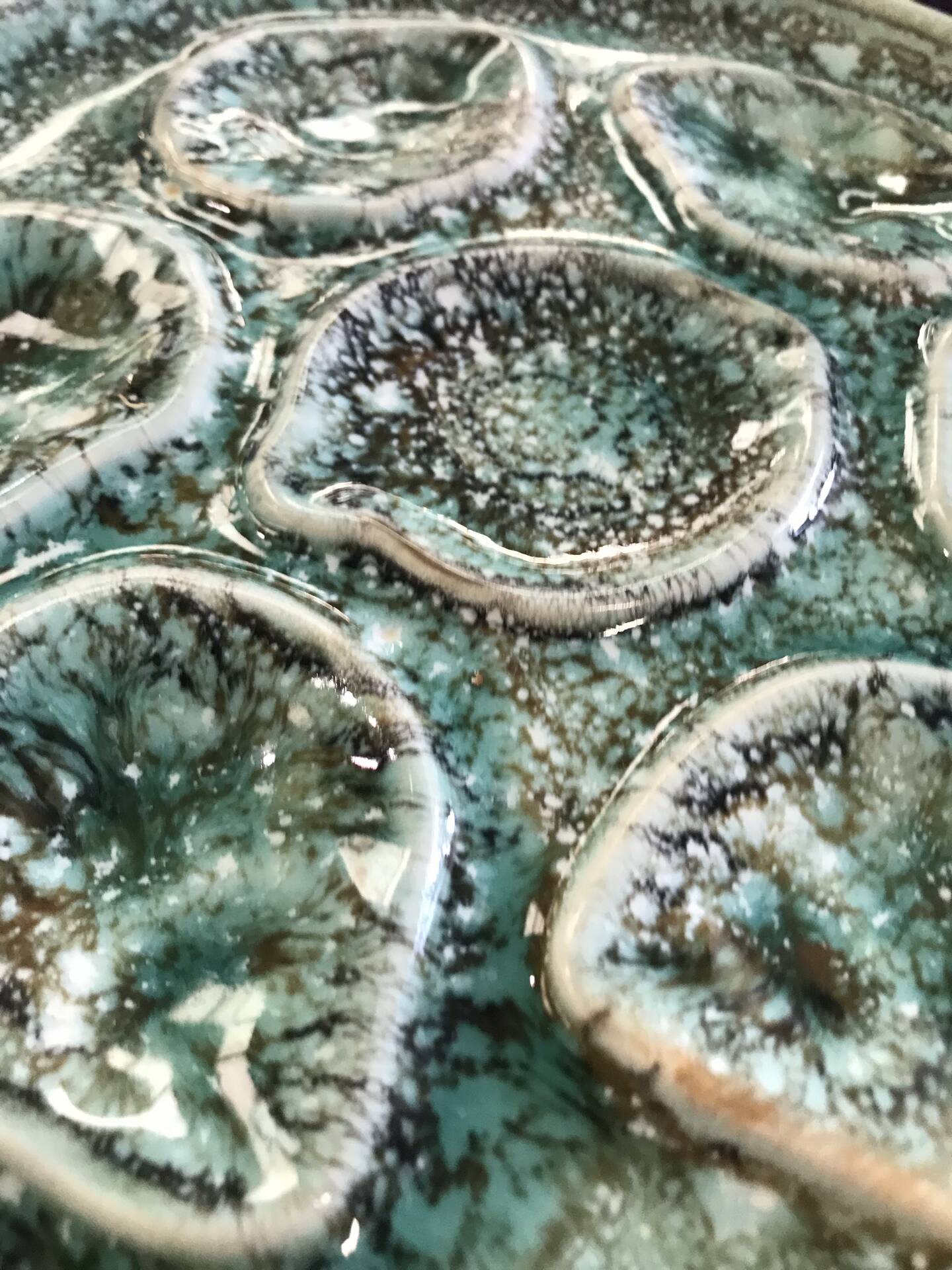 Set of 12 plates and an oyster dish or other in majolica.