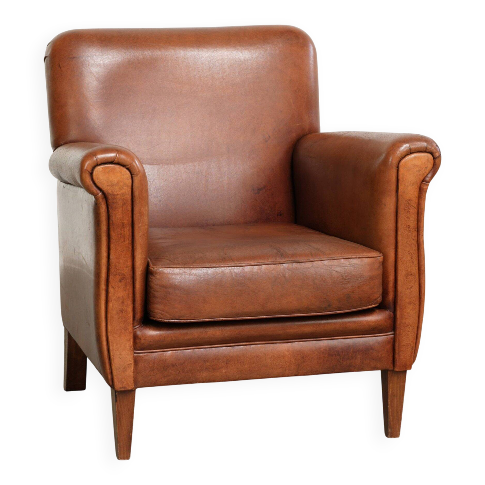 Sturdy vintage sheepskin armchair with a beautiful cognac colour