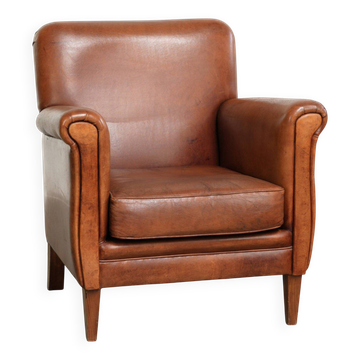 Sturdy vintage sheepskin armchair with a beautiful cognac colour