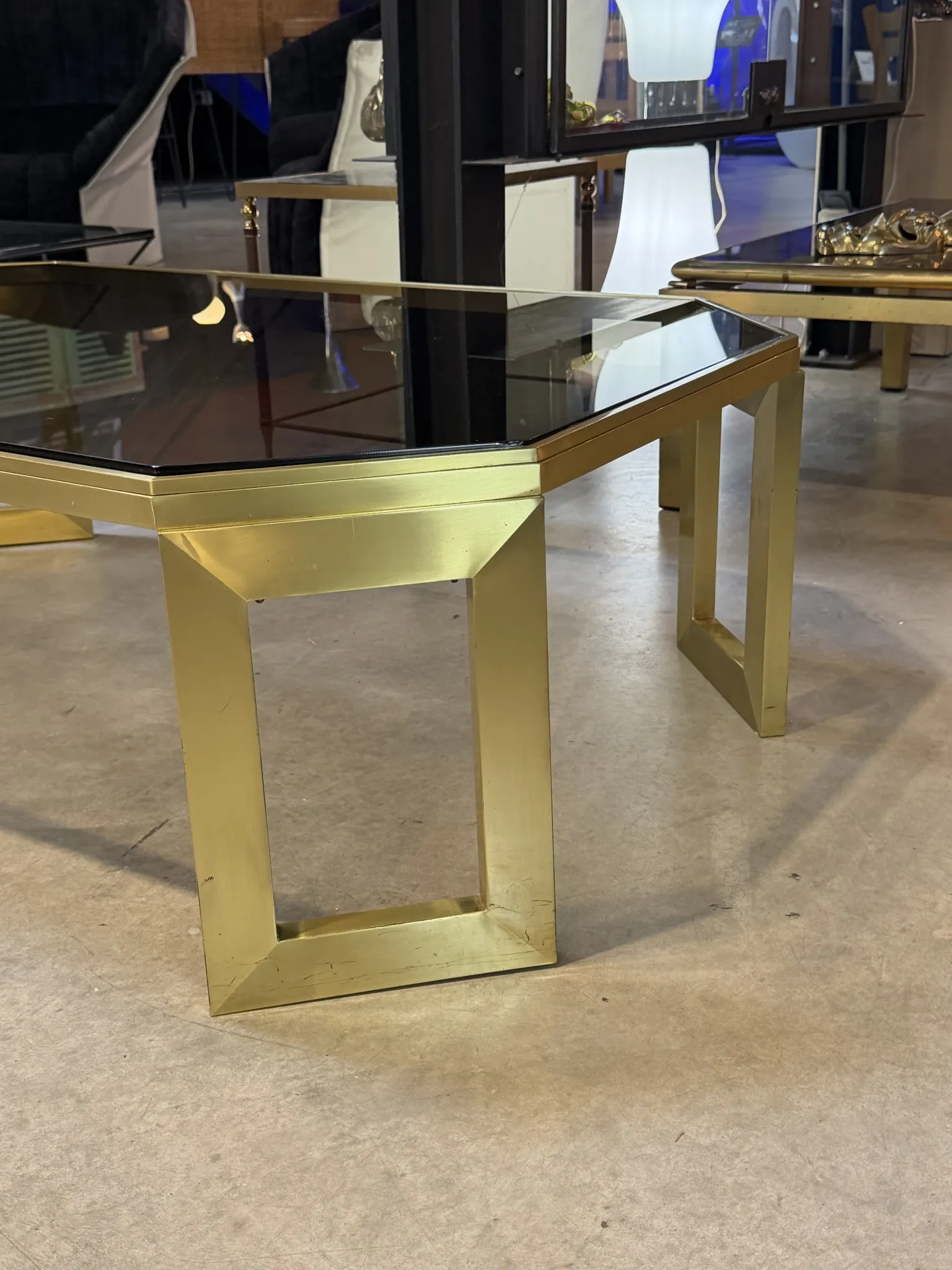 Octagonal brass coffee table, signed Anna Nora.