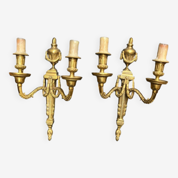 Pair of wall lights. Solid gilded bronze.