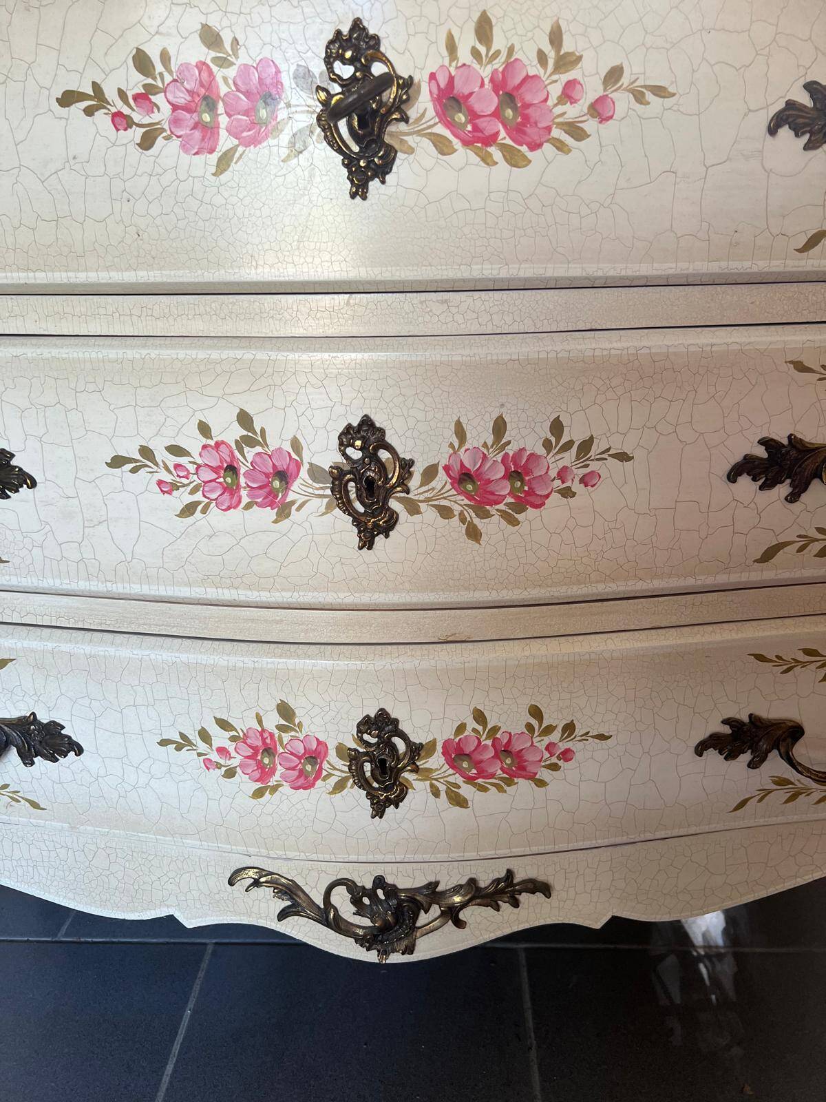 Curved Louis XV style commode in marble with painted floral decoration.