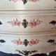 Curved Louis XV style commode in marble with painted floral decoration.