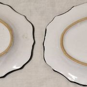 Pair of oval dishes in hand-painted faience with an Italian majolica spirit.
