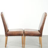 Set of 2 characterful dining chairs of sheepskin leather with a high back