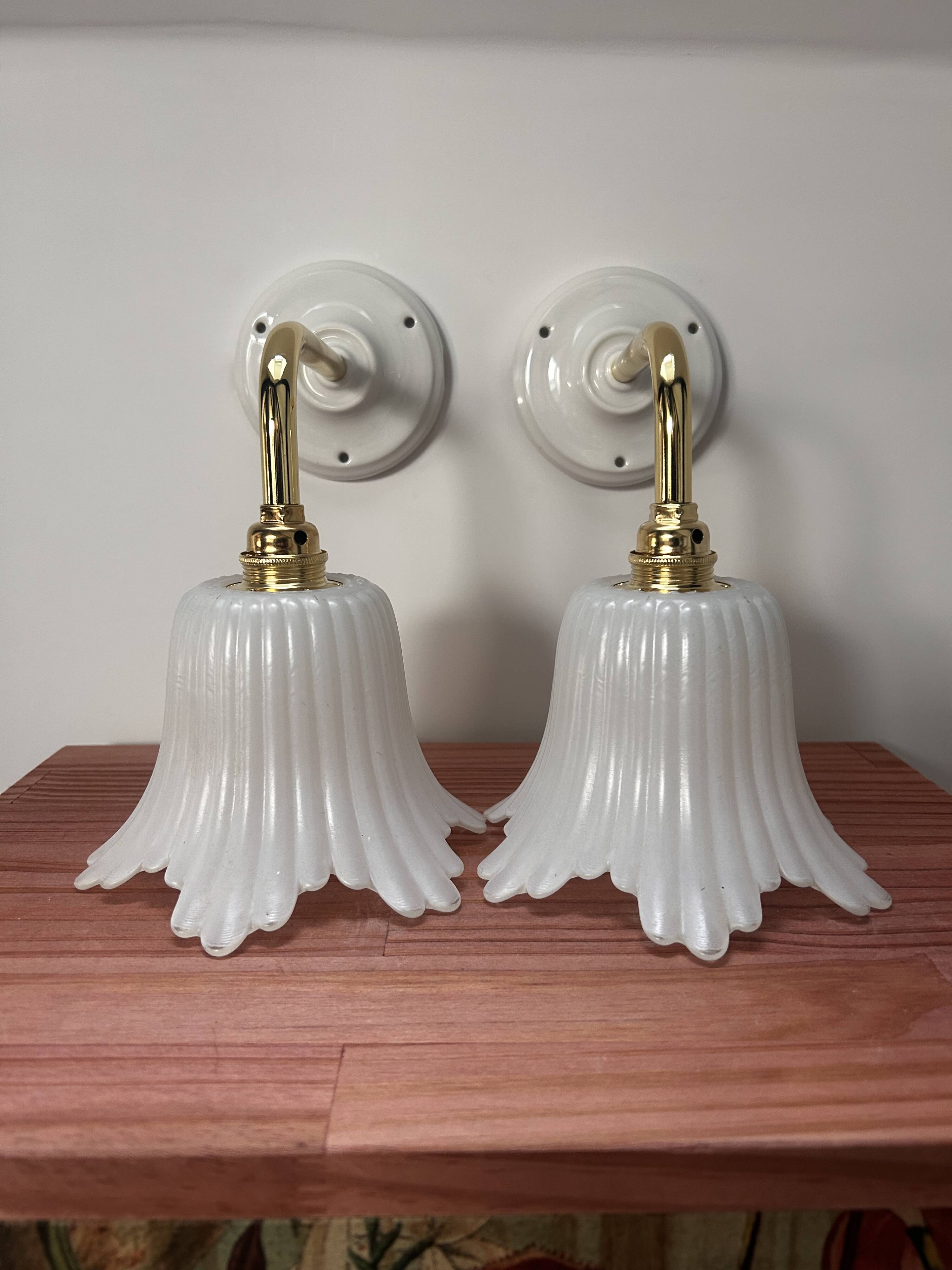 Pair of white tulip wall sconces