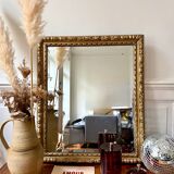 Bevelled mirror in carved gilded wood