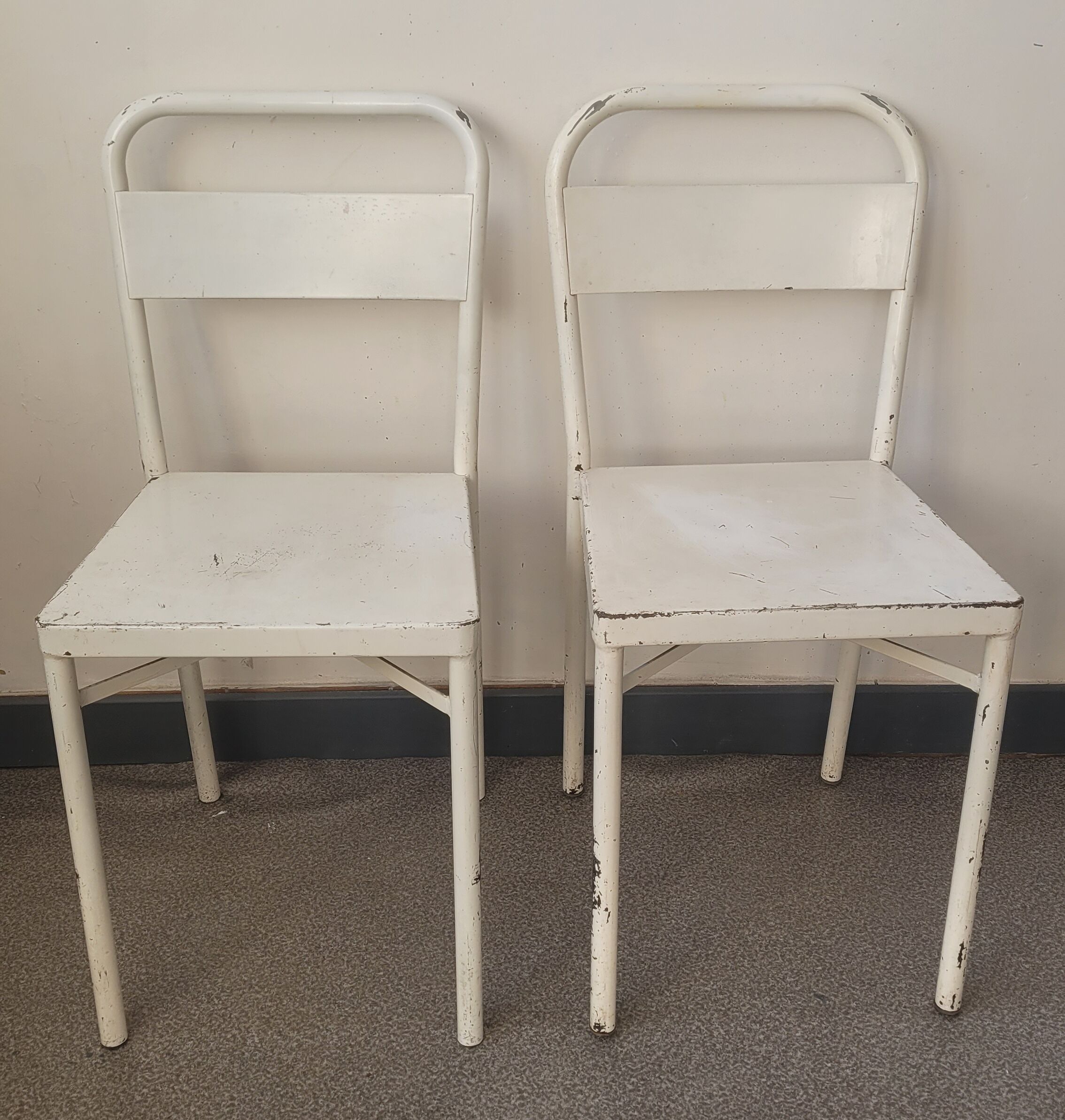 Pair of patinated white metal chairs
