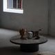 Round brutalist coffee table in stone and steel, mid-century French modernism, 1970s.