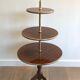 Round table of neoclassical style with triple plateaux 1940