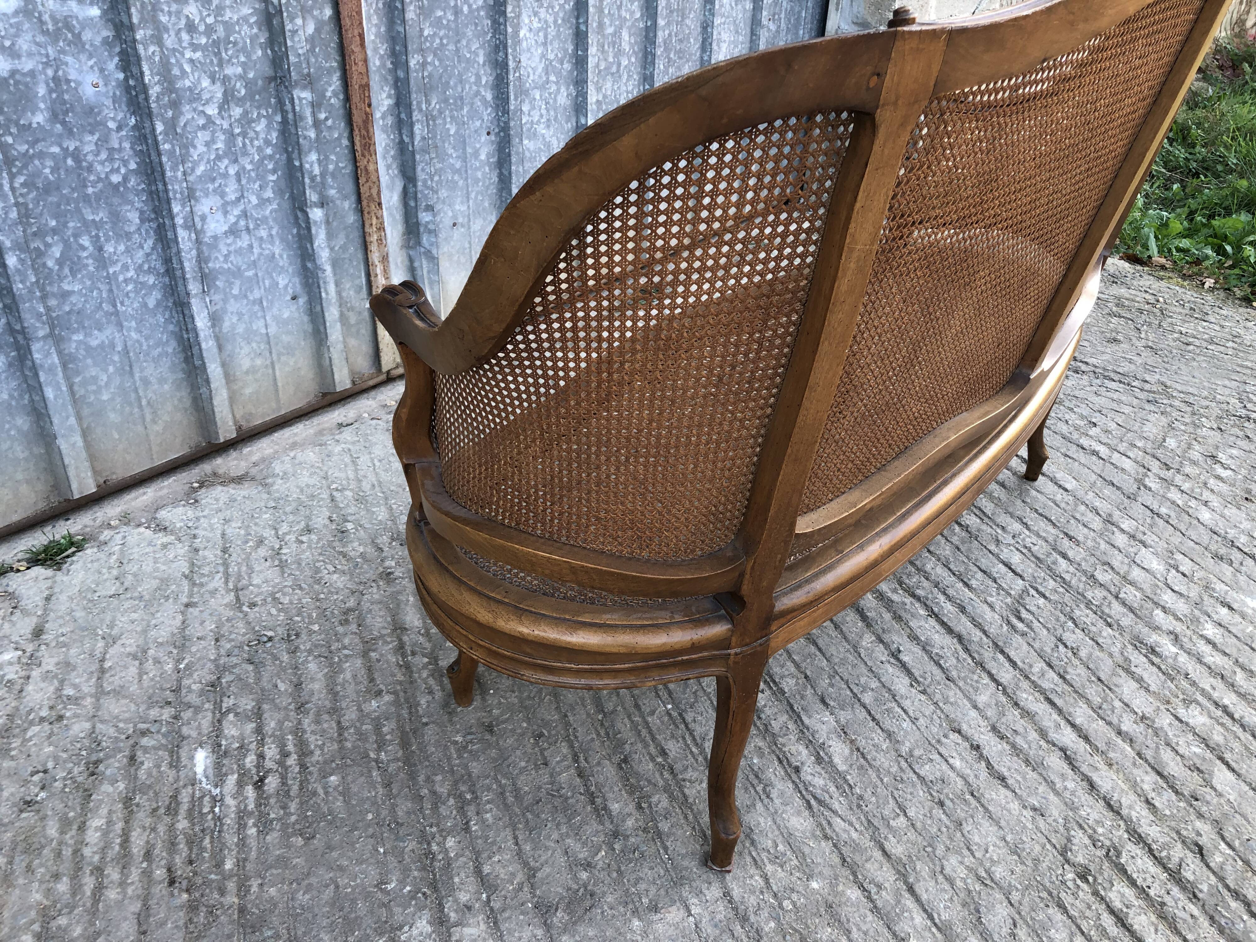 Antique Louis XV bench in solid walnut and caning