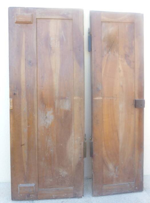 Pair of antique cherry wood cabinet doors from the 19th century in their original part