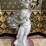 Stone garden statue to the child