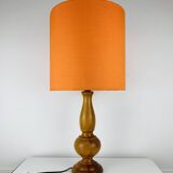 Turned wood lamp with orange shade, 1970s.