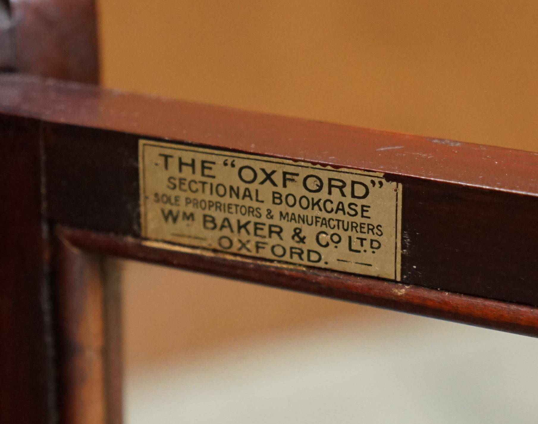 Antique pair of legal bookcases by William Baker Co in hardwood, satin and walnut.