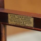 Antique pair of legal bookcases by William Baker Co in hardwood, satin and walnut.