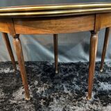 A Louis XVI period mahogany half-moon table forming a console/games table