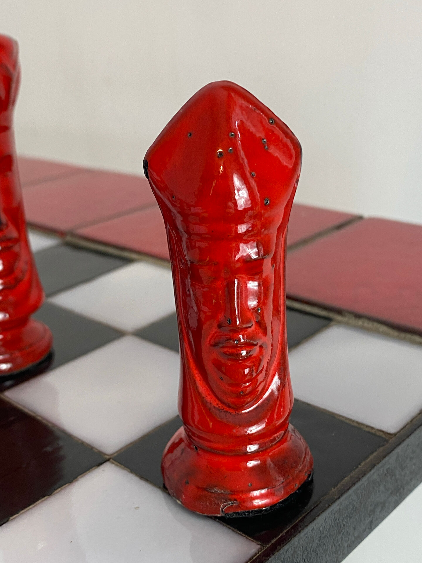 Chess set with ceramic board and pieces.