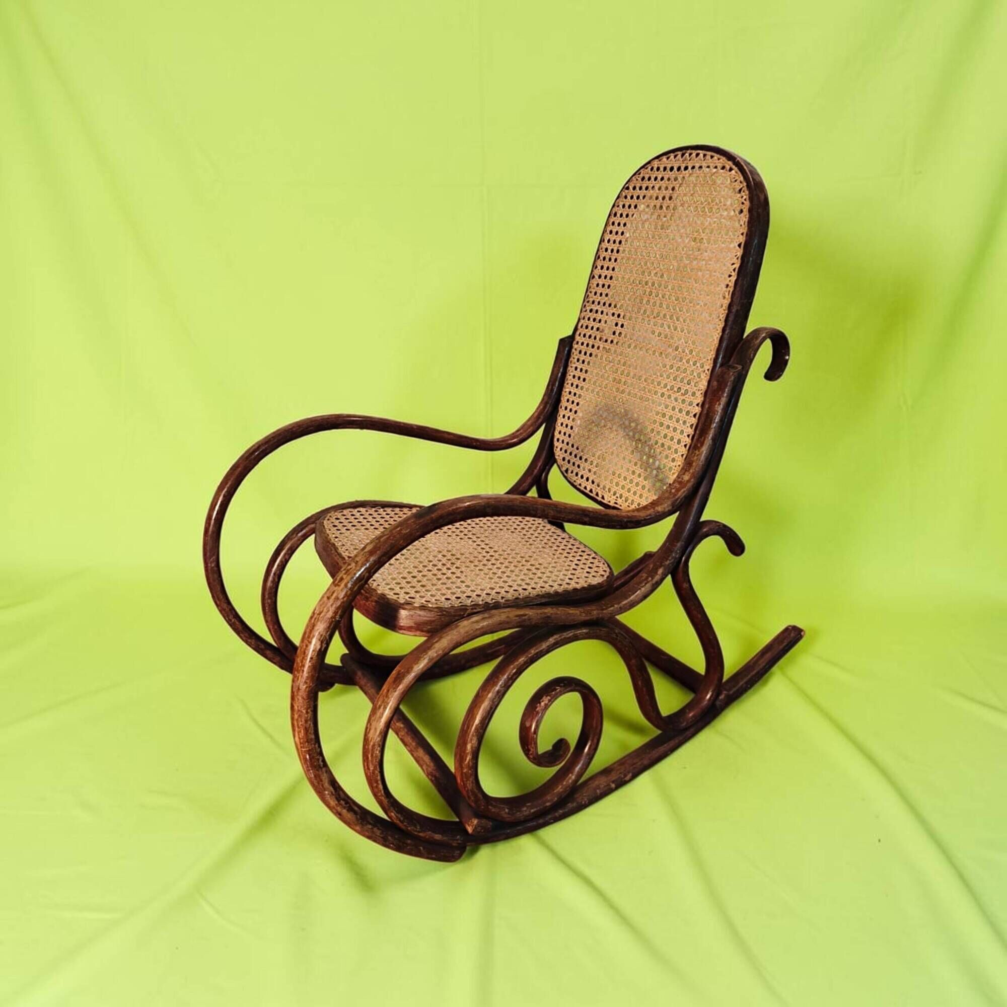 Antique curved wooden rocking chair with caning in Thonet style - Child size