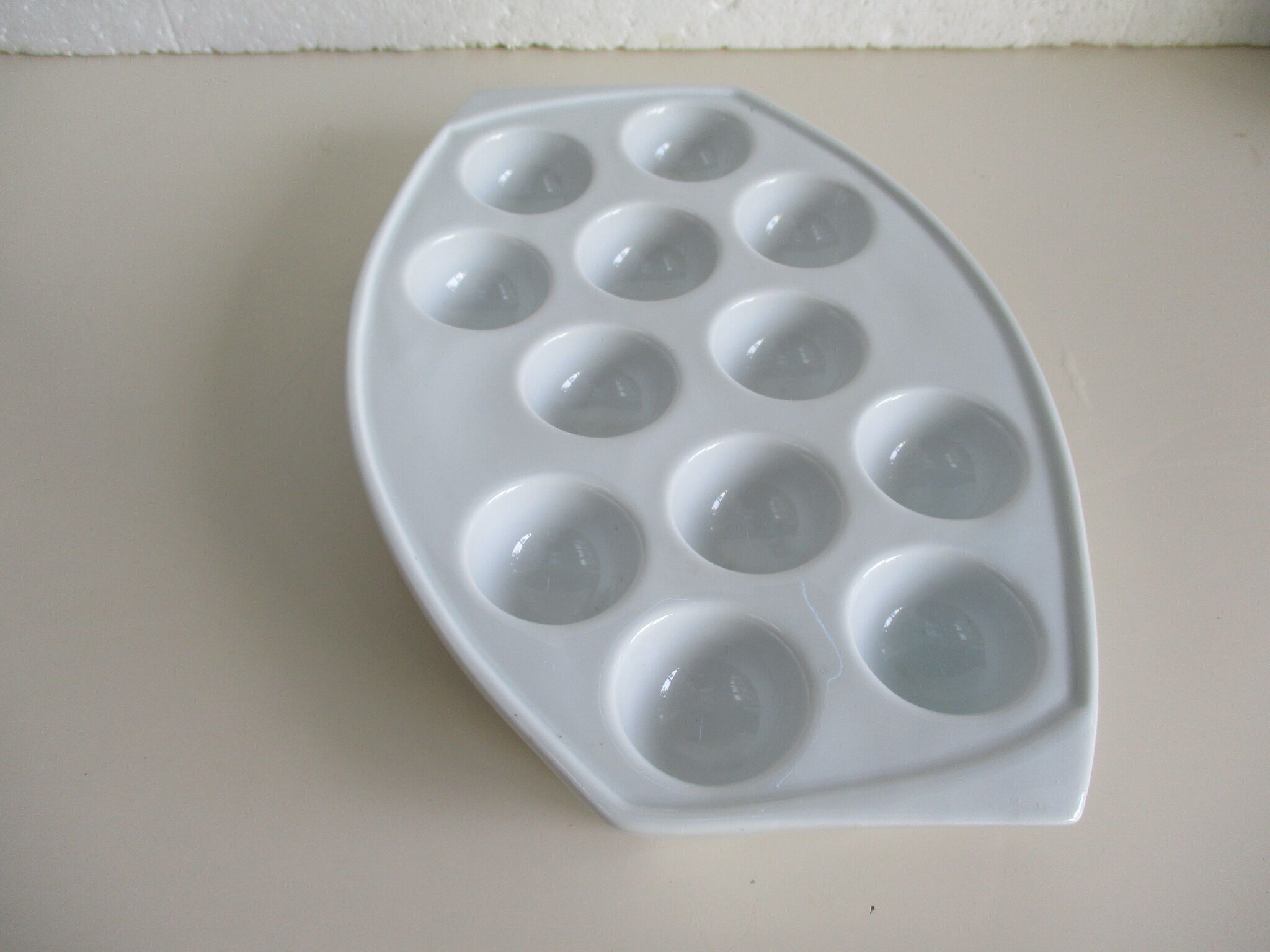 White porcelain snail dish