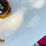 Vintage oak farmhouse table with a white top.