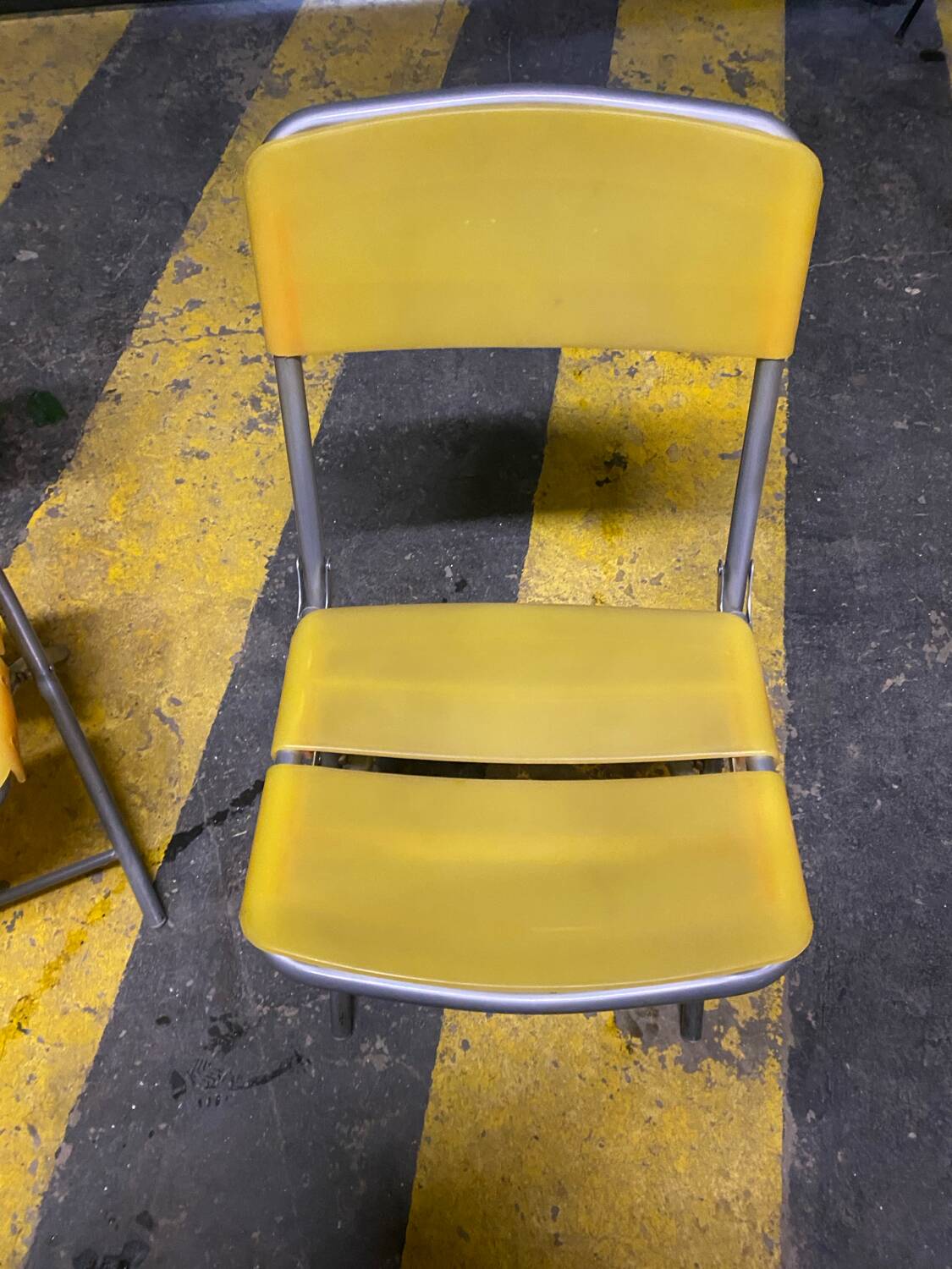 Yellow plastic and steel folding chairs, 1970s