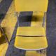 Yellow plastic and steel folding chairs, 1970s