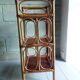 Shelf selette on wooden feet and vintage rattan