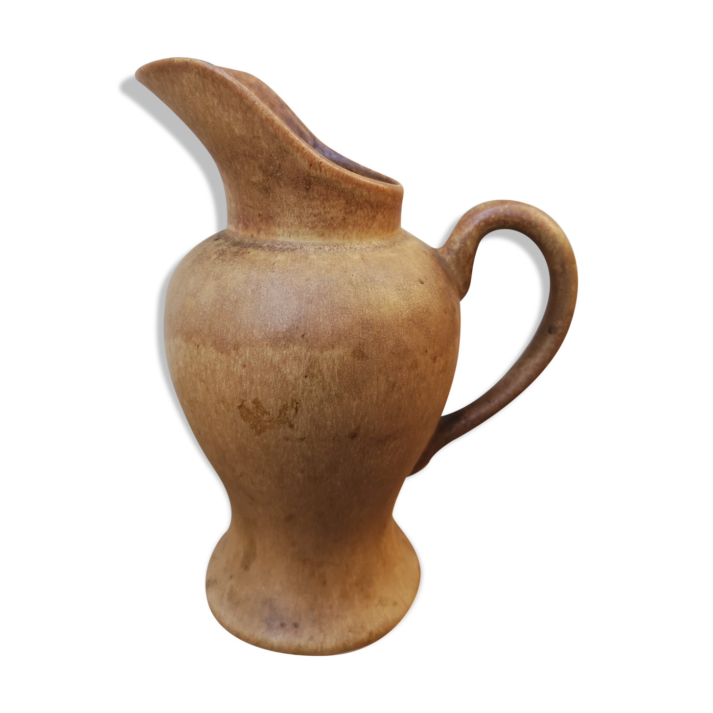 Pitcher in brown sandstone