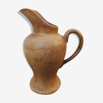 Pitcher in brown sandstone