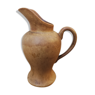 Pitcher in brown sandstone