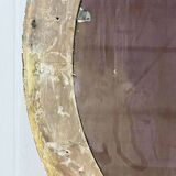 Large golden oval mirror
