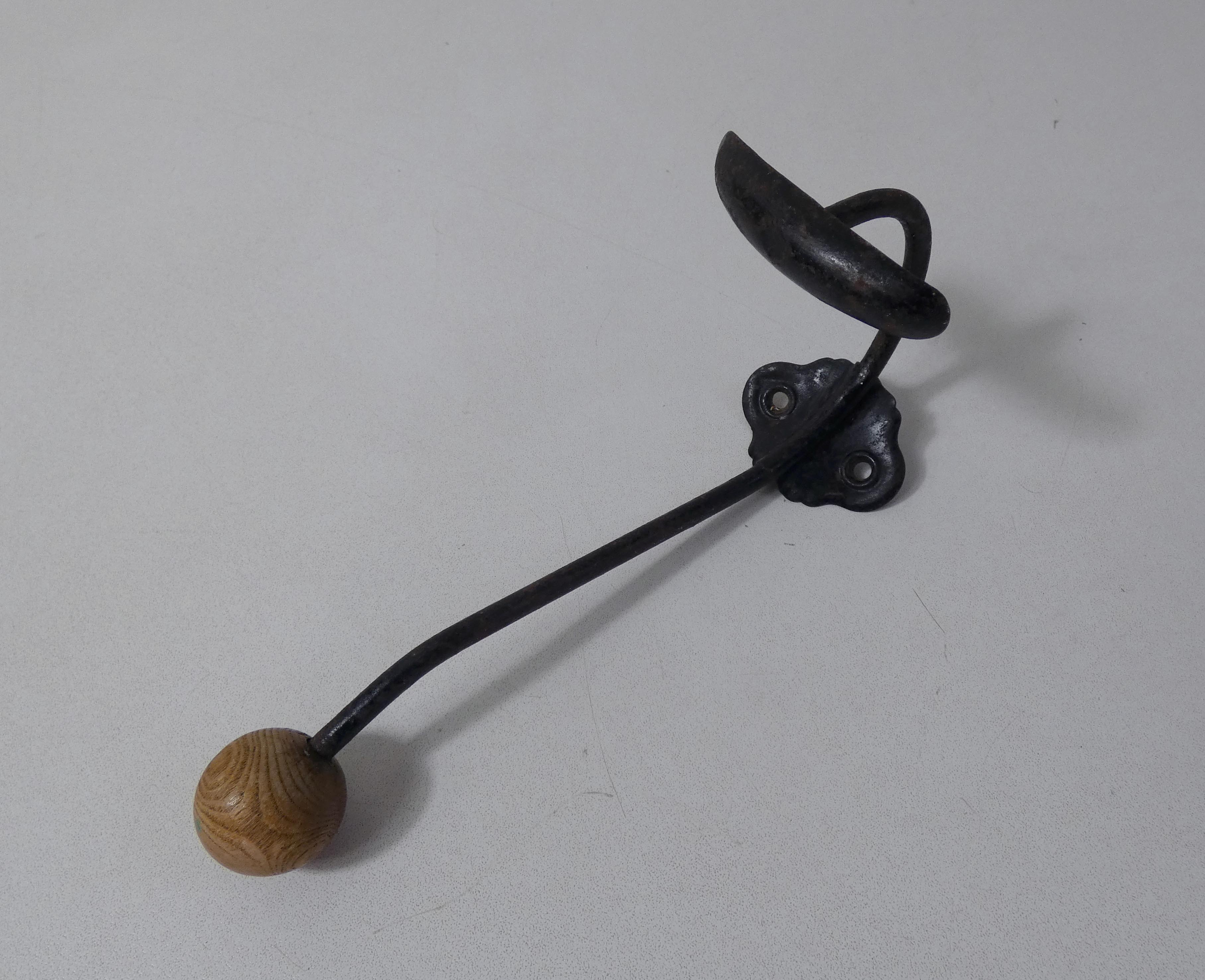 Old metal hook and wooden ball