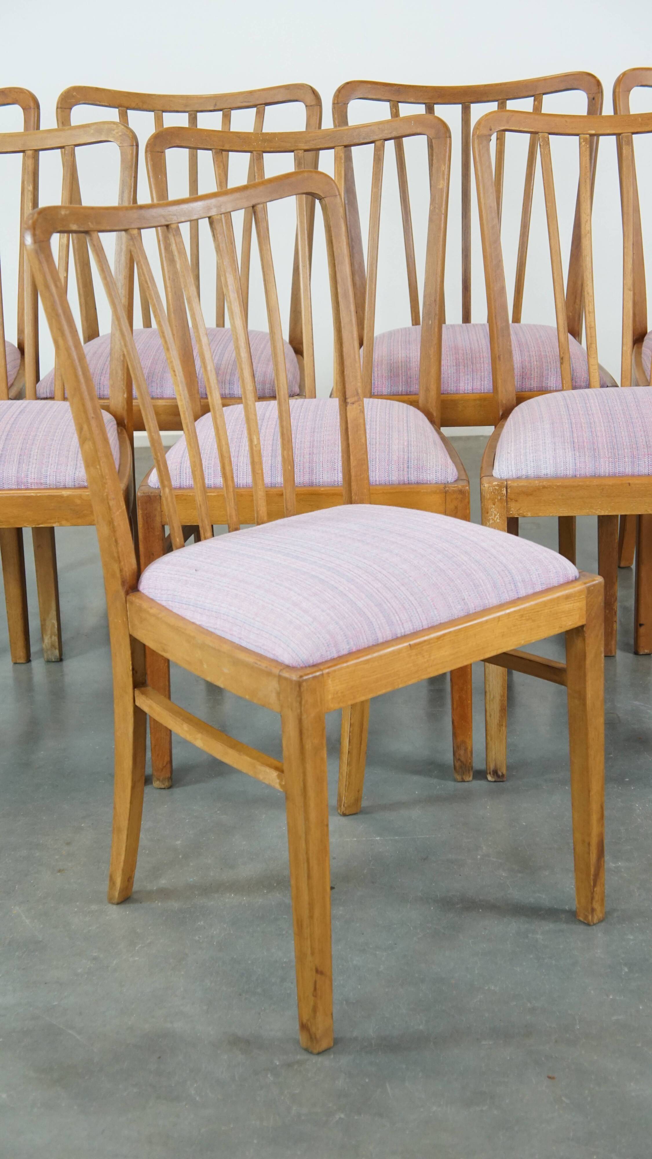 Set of 8 vintage Danish design dining chairs from the 1970s with light purple fabric seats