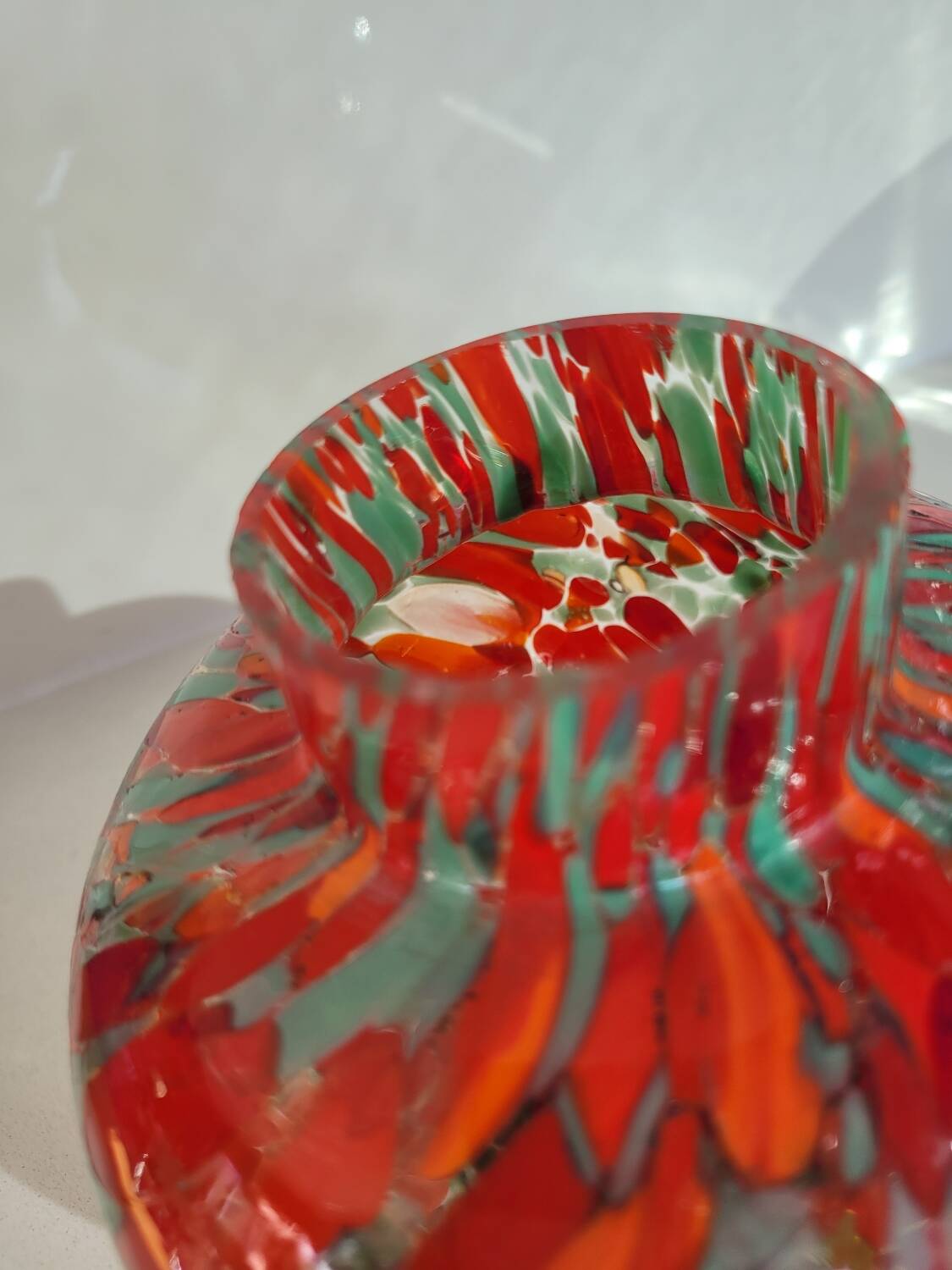 Old multi-colored glass flower vase