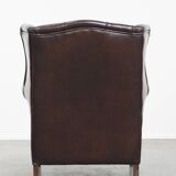 Very beautiful wing chair made of cowhide leather in English style