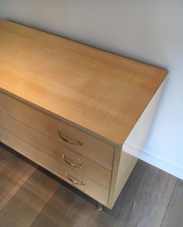 Eggshell lacquered chest of drawers with brushed steel legs. In the style of Knoll.