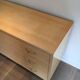 Eggshell lacquered chest of drawers with brushed steel legs. In the style of Knoll.