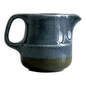 Small blue and beige ceramic milk jug