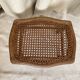 Low wooden stool with caning, footrest.