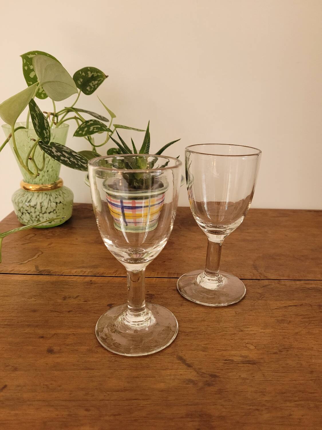 2 small stemmed glasses
